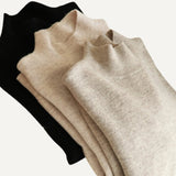 Suéteres elegantes cuello alto para mujeres. Jersey ajustado manga larga.